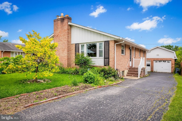 8320 Overmont, Parkville, MD 21234 - view of front facade featuring brick siding, a chimney, a garage, an outdoor structure, and board and batten siding