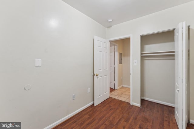 1707 H St NE, Washington, DC 20002 - unfurnished bedroom featuring wood finished floors, a closet, and baseboards