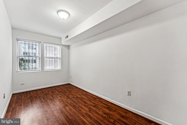 1707 H St NE, Washington, DC 20002 - empty room featuring wood finished floors and baseboards