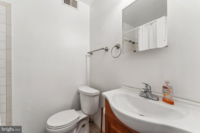 1707 H St NE, Washington, DC 20002 - bathroom featuring toilet, vanity, and a shower with shower curtain