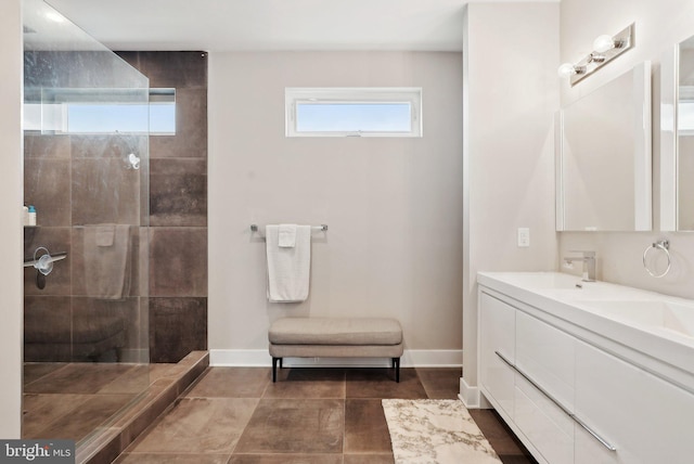2811 Wharton St, Philadelphia, PA 19146 - full bathroom featuring walk in shower, double vanity, and baseboards