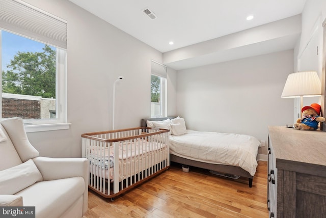 2811 Wharton St, Philadelphia, PA 19146 - bedroom featuring multiple windows, light wood-style flooring, and recessed lighting