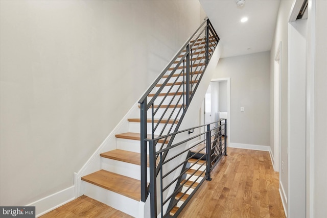 2811 Wharton St, Philadelphia, PA 19146 - stairway featuring wood finished floors, baseboards, and recessed lighting