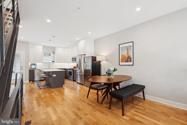 2811 Wharton St, Philadelphia, PA 19146 - dining room with light wood-type flooring, baseboards, and recessed lighting