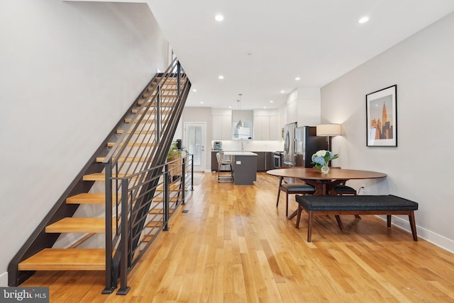 2811 Wharton St, Philadelphia, PA 19146 - dining area with stairs, light wood-style floors, recessed lighting, and baseboards