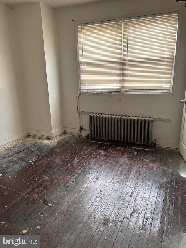 1436 S Etting St, Philadelphia, PA 19146 - spare room with radiator heating unit, hardwood / wood-style floors, baseboards, and healthy amount of natural light