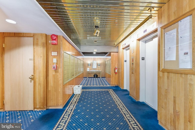 801 N Pitt St Unit 505, Alexandria, VA 22314 - hall featuring wooden walls, elevator, and carpet