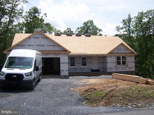 223 Fairview Oaks Ln, Berkeley Springs, WV 25411 - property in mid-construction with a garage, roof with shingles, and gravel driveway
