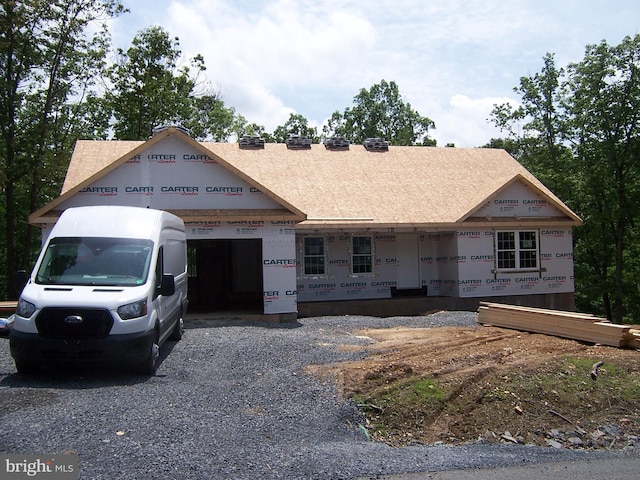 223 Fairview Oaks Ln, Berkeley Springs, WV 25411 - unfinished property featuring a garage and gravel driveway