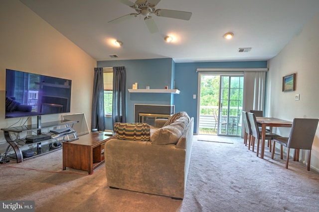 304 Trinity Ct Unit 11, Princeton, NJ 08540 - carpeted living room featuring a glass covered fireplace, ceiling fan, lofted ceiling, and baseboards