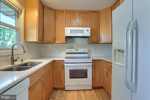 1507 Hemlock Ave, Carlisle, PA 17013 - kitchen featuring white appliances, a sink, light countertops, and light wood-type flooring
