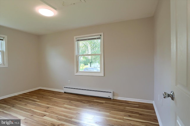 1507 Hemlock Ave, Carlisle, PA 17013 - unfurnished room featuring baseboard heating, hardwood / wood-style floors, and baseboards