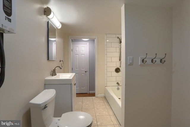 1507 Hemlock Ave, Carlisle, PA 17013 - full bath featuring toilet, water heater, tile patterned floors, vanity, and bathtub / shower combination