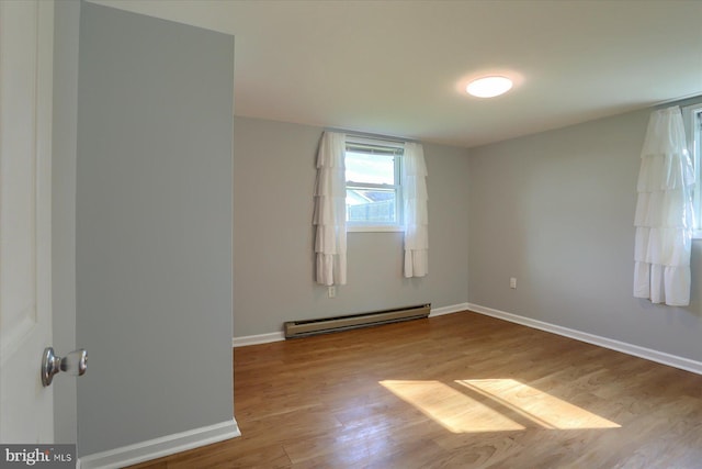 1507 Hemlock Ave, Carlisle, PA 17013 - unfurnished room with baseboard heating, wood finished floors, and baseboards