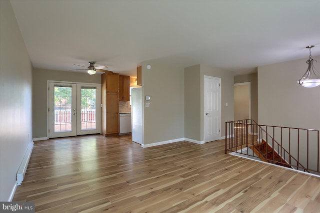 1507 Hemlock Ave, Carlisle, PA 17013 - unfurnished living room featuring a baseboard heating unit, light wood-style flooring, and baseboards