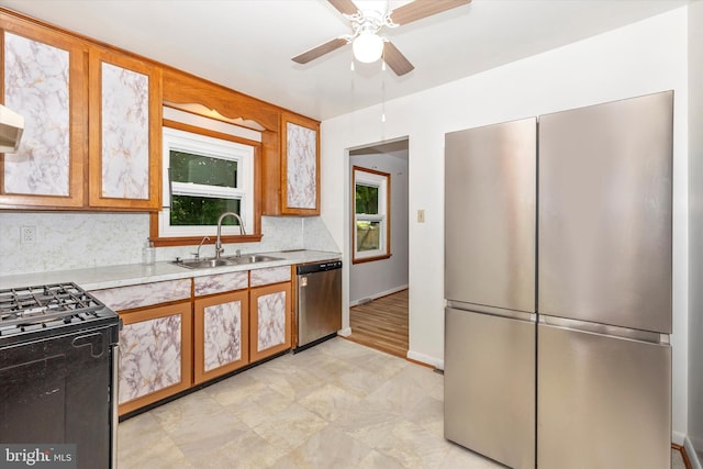 10801 Oak Valley Dr, Hagerstown, MD 21740 - kitchen featuring stainless steel appliances, a sink, light countertops, a ceiling fan, and backsplash