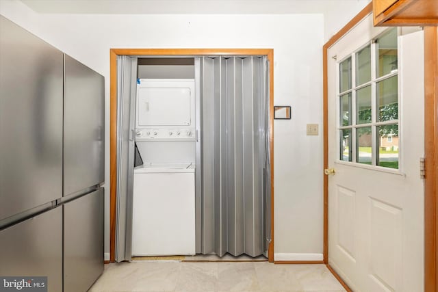 10801 Oak Valley Dr, Hagerstown, MD 21740 - laundry room with stacked washer / drying machine and baseboards