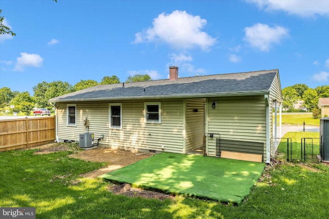 10801 Oak Valley Dr, Hagerstown, MD 21740 - rear view of house featuring a chimney, roof with shingles, and central AC