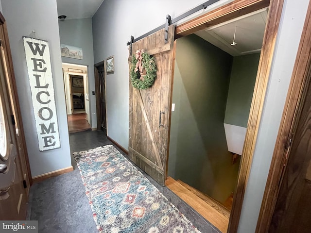4306 National Pike, Markleysburg, PA 15459 - corridor featuring a barn door, attic access, and baseboards