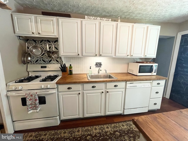 4306 National Pike, Markleysburg, PA 15459 - kitchen with white appliances, butcher block counters, a sink, white cabinets, and a textured ceiling