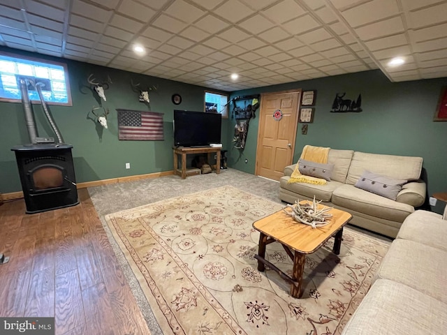 4306 National Pike, Markleysburg, PA 15459 - living area featuring a wood stove, wood finished floors, and baseboards