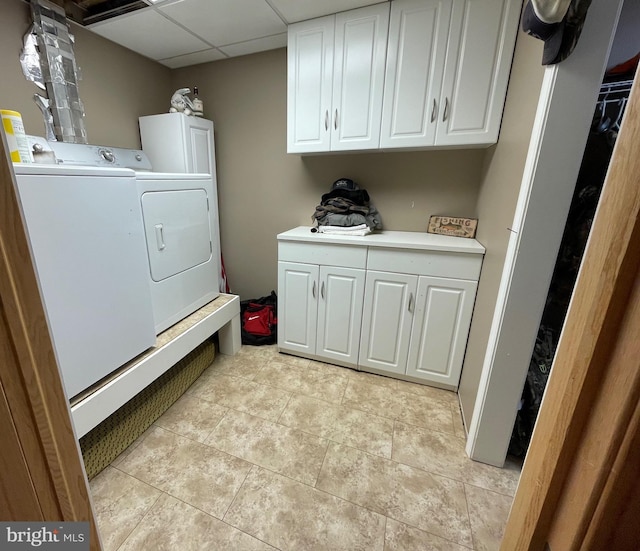 4306 National Pike, Markleysburg, PA 15459 - laundry area featuring washer and dryer, cabinet space, and light tile patterned floors