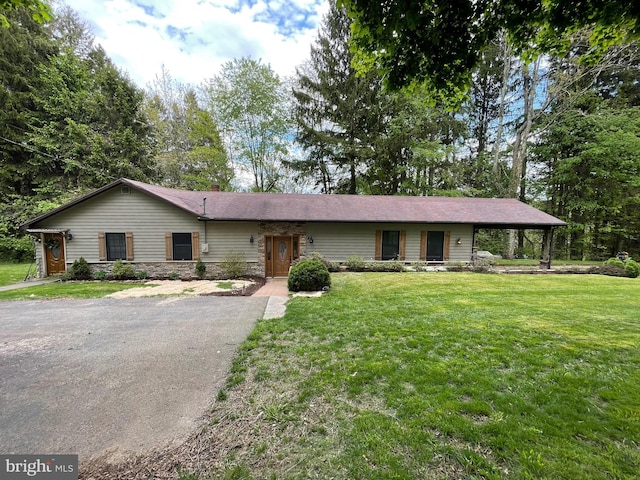 4306 National Pike, Markleysburg, PA 15459 - ranch-style home with a front yard, asphalt driveway, and stone siding