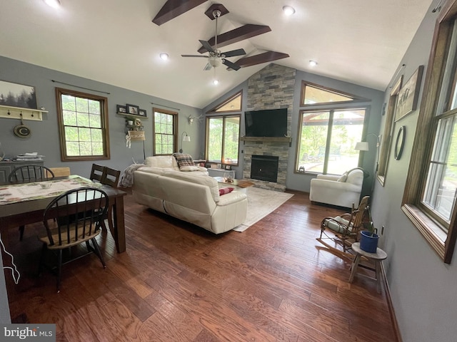4306 National Pike, Markleysburg, PA 15459 - living room featuring lofted ceiling, dark wood-style flooring, ceiling fan, a stone fireplace, and baseboards
