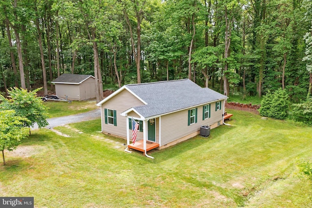 21363 Indiana Ave, Chestertown, MD 21620 - view of front of house with a shingled roof, a front lawn, gravel driveway, cooling unit, and a wooden deck