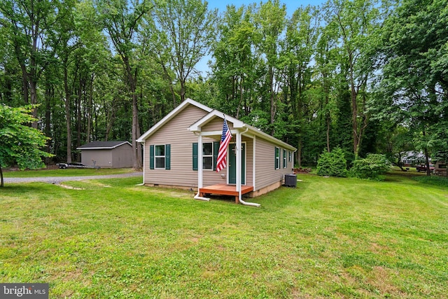 21363 Indiana Ave, Chestertown, MD 21620 - view of front of house featuring a front lawn, central AC unit, and an outdoor structure