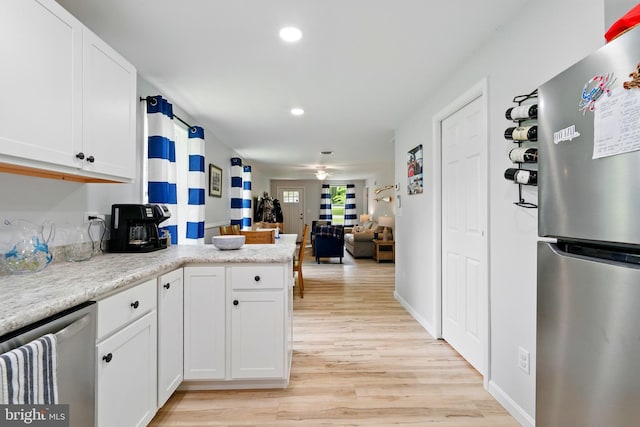 21363 Indiana Ave, Chestertown, MD 21620 - kitchen with appliances with stainless steel finishes, light wood finished floors, white cabinets, a peninsula, and recessed lighting