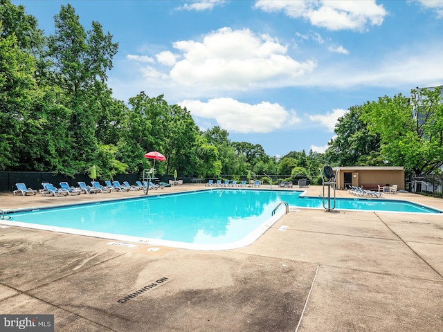 7333 New Hampshire Ave Unit 603, Takoma Park, MD 20912 - community pool featuring a patio area and view of wooded area
