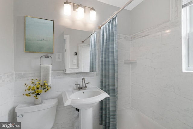 1724 W Abingdon Dr Unit 201, Alexandria, VA 22314 - bathroom featuring shower / tub combo and tile walls