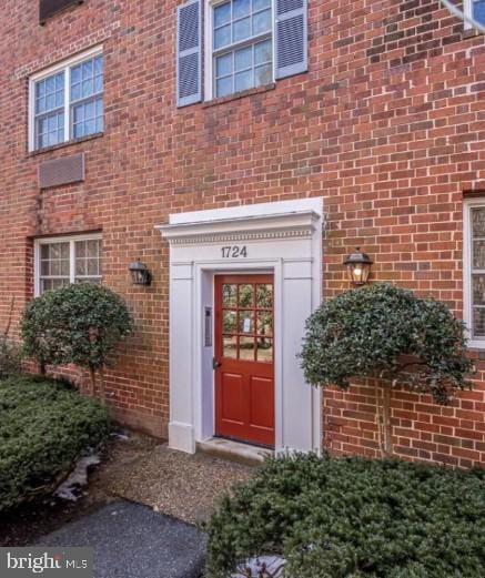 1724 W Abingdon Dr Unit 201, Alexandria, VA 22314 - view of exterior entry featuring brick siding