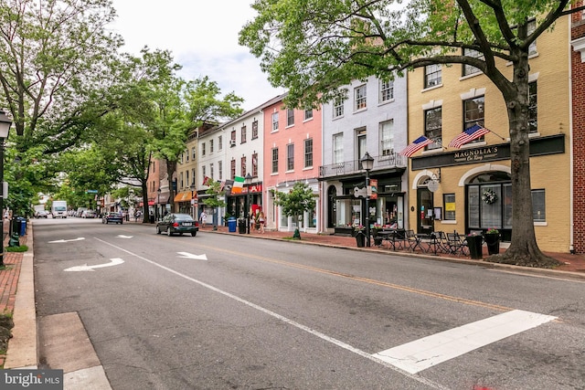 1724 W Abingdon Dr Unit 201, Alexandria, VA 22314 - view of asphalt road with curbs, sidewalks, and street lights