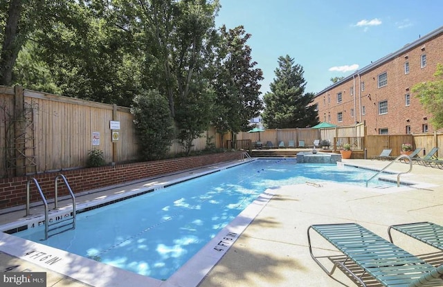 1724 W Abingdon Dr Unit 201, Alexandria, VA 22314 - community pool featuring a fenced backyard and a patio