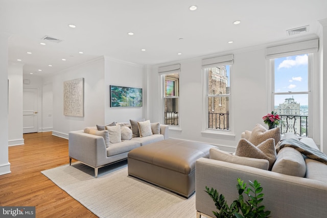 1901 Walnut St Unit 20E, Philadelphia, PA 19103 - living room with ornamental molding, light wood-style flooring, recessed lighting, and baseboards