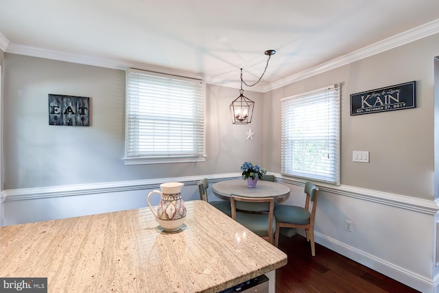 3819 14th St S, Arlington, VA 22204 - dining area with crown molding, a chandelier, dark wood-style floors, and baseboards