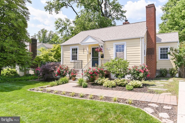 3819 14th St S, Arlington, VA 22204 - bungalow-style house featuring a front lawn, a chimney, and roof with shingles