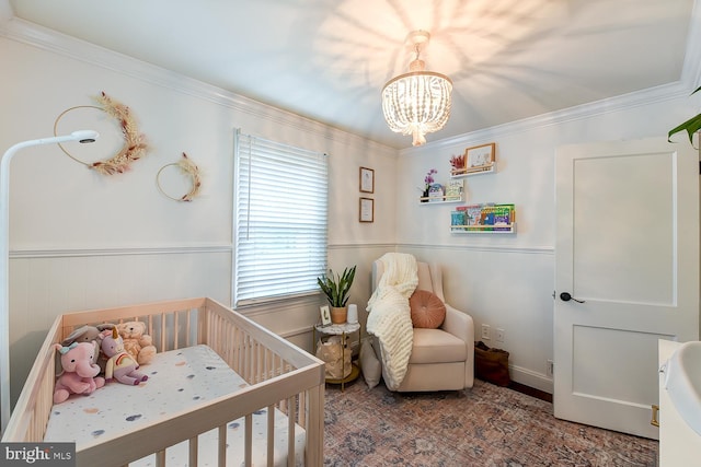 3819 14th St S, Arlington, VA 22204 - bedroom with a nursery area, a chandelier, a wainscoted wall, and ornamental molding
