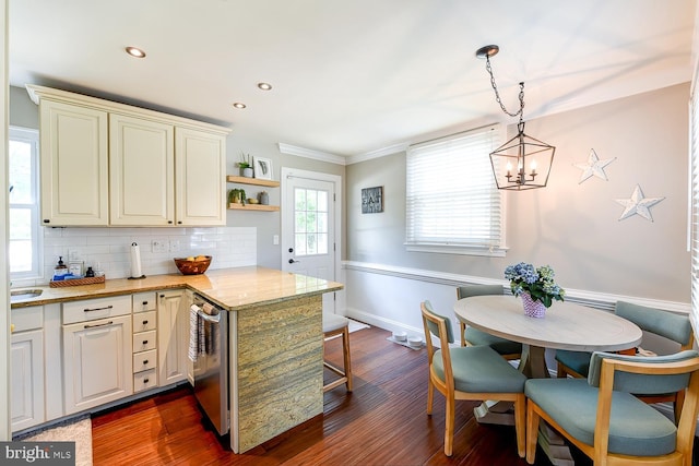 3819 14th St S, Arlington, VA 22204 - kitchen with a chandelier, backsplash, dark wood-style flooring, a peninsula, and baseboards