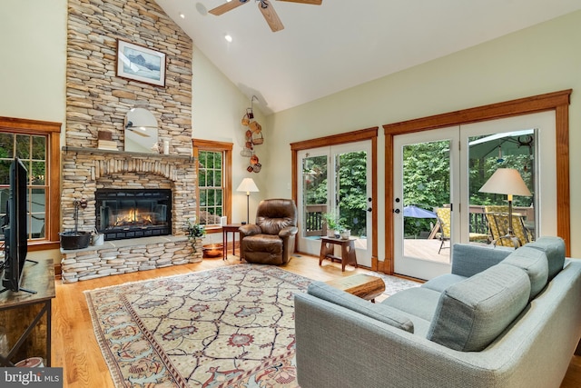 4510 Fish Hawk Ct, Chesapeake Beach, MD 20732 - living area with a ceiling fan, high vaulted ceiling, a fireplace, and wood finished floors