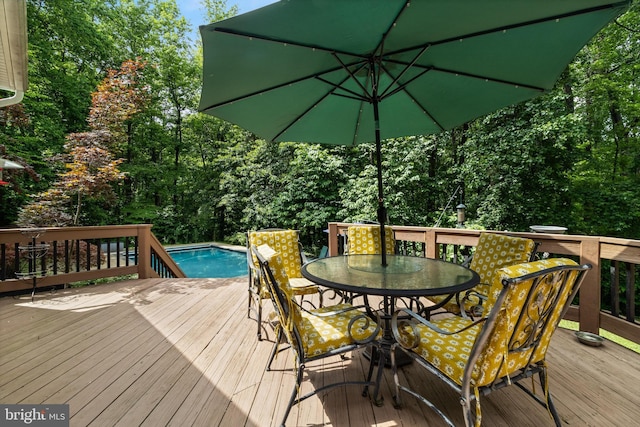 4510 Fish Hawk Ct, Chesapeake Beach, MD 20732 - deck with outdoor dining space and an outdoor pool