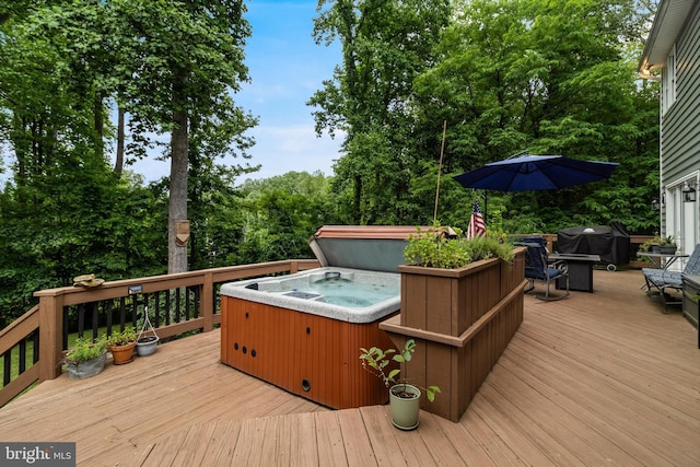 4510 Fish Hawk Ct, Chesapeake Beach, MD 20732 - wooden deck with a hot tub and a grill