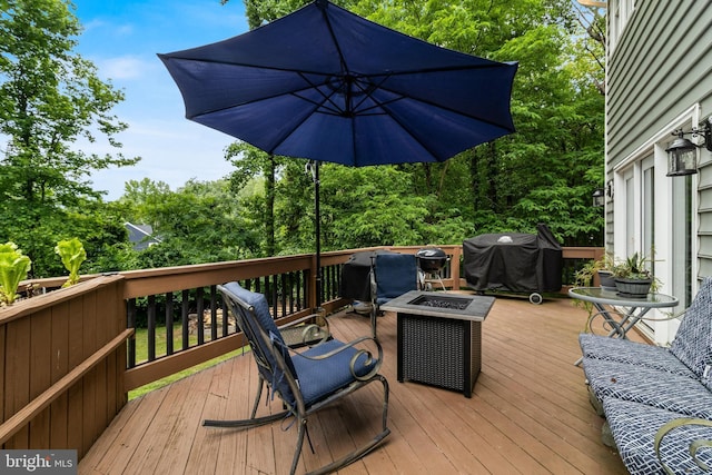 4510 Fish Hawk Ct, Chesapeake Beach, MD 20732 - wooden deck featuring a grill, an outdoor fire pit, and view of scattered trees