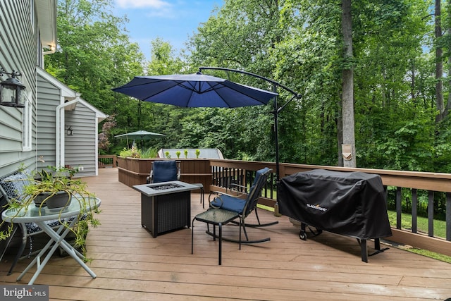 4510 Fish Hawk Ct, Chesapeake Beach, MD 20732 - deck featuring grilling area and an outdoor fire pit