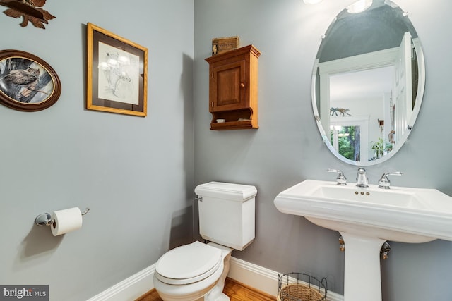 4510 Fish Hawk Ct, Chesapeake Beach, MD 20732 - half bathroom featuring toilet and baseboards