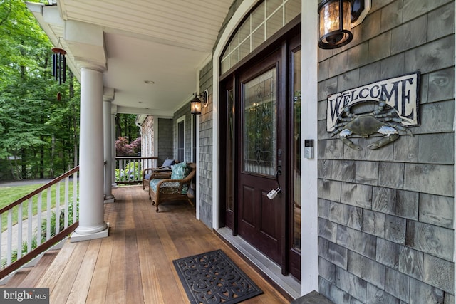 4510 Fish Hawk Ct, Chesapeake Beach, MD 20732 - view of exterior entry featuring a porch
