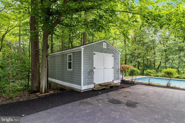 4510 Fish Hawk Ct, Chesapeake Beach, MD 20732 - view of shed featuring an outdoor pool
