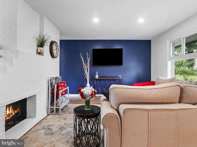 5902 Amelia St, Springfield, VA 22150 - living room featuring wood finished floors, a brick fireplace, recessed lighting, and baseboards